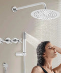 Shower System Wall Mounted 10 Inch Rainfall with Handheld Spray Combo in elegant bathroom setting with woman enjoying shower.
