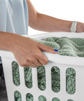 Person holding a 12 Pack Rectangular Laundry Basket with Handles, Heavy Duty Plastic Hamper, 1.5 Bushel Capacity, White Laundry Organizer