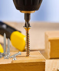 Close-up of wood being drilled with screws from Eight Hundred Piece M2 304 Grade Stainless Steel Screws Assortment Kit