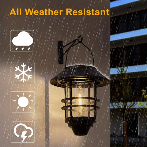 2 Pack Solar Lanterns Outdoor Hanging Lights For Porch Fence Yard Glass Metal Waterproof Dusk To Dawn Auto On Warm White LED Garden Lanterns With Wall Mount Bracket illuminated in rain
