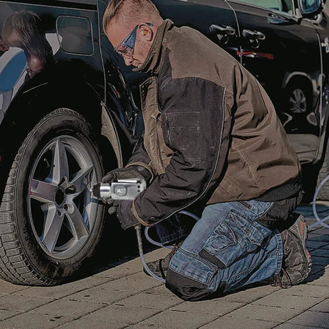 Butterfly Style Pneumatic Impact Wrench With Three Eighth Inch Drive And One Hundred Foot Pound Torque Compact Lightweight Air Tool used for bolt removal.