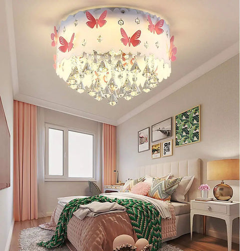 Pink Butterfly LED Crystal Chandelier Flush Mount Ceiling Light with Drum Shade in a girl's bedroom setup.