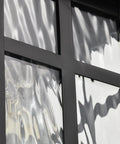 Built Different Matte Black Outdoor Wall Lights With Dusk To Dawn Motion Sensor And Water Glass Shade showing textured glass panel detail.