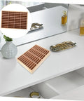 Wooden Multi Grid Ring Holder on a sleek white desk, ideal for organizing rings and holding smartphones. Deck Out Your Desk With This Slick Wooden Jewelry Organizer Multi Grid Ring Holder And Sassy Lipstick Tray Dual Purpose Cell Phone Stand Pretty Home Decor.