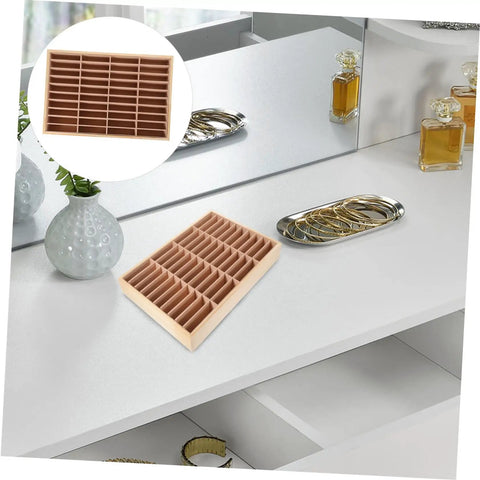 Wooden Multi Grid Ring Holder on a sleek white desk, ideal for organizing rings and holding smartphones. Deck Out Your Desk With This Slick Wooden Jewelry Organizer Multi Grid Ring Holder And Sassy Lipstick Tray Dual Purpose Cell Phone Stand Pretty Home Decor.
