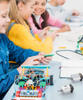 Children assembling STEM projects with 40 Pack DC Motors 1.5 To 3 Volt 23000 RPM Mini Hobby Electric Motors on a table.