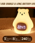 Cute Bear Night Light For Kids, Soft BPA-Free Silicone Nursery Lamp with digital clock display showing 23:47 on a cozy surface.