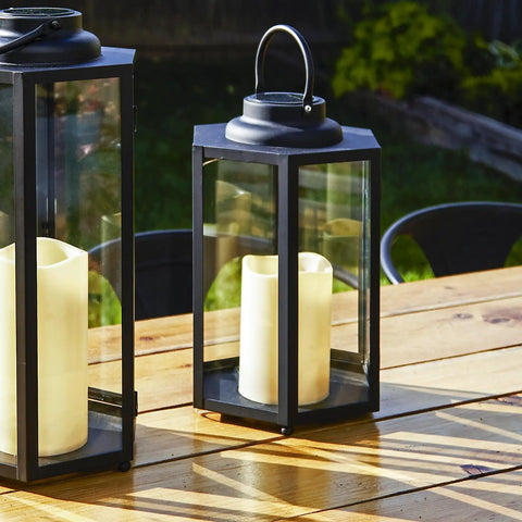 Outdoor Solar Powered Lantern With Flameless Candle For Porch Or Patio, waterproof black metal and glass light on table