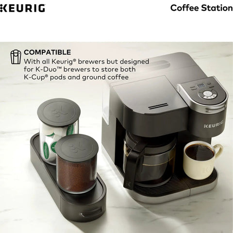 K Cup Pod And Ground Coffee Storage Organizer With Airtight Glass Canisters Holds 12 Oz Ground Coffee And 12 K Cup Pods Black Modern Kitchen Countertop Storage next to black coffee machine on white counter.
