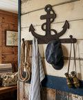 Badass Vintage Vibes 10 Inch Cast Iron Nautical Anchor Hook For Heavy Duty Wall Storage And Totally Rad Farmhouse Decor, mounted with ropes and accessories.