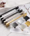 Various colors of cabinet pulls and knobs displayed on a marble surface, including 10 Pack 5 Inch Hole Center Brushed Nickel Cabinet Pulls Satin Nickel Hardware For Cabinets Drawers.