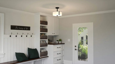 Porter Semi Flush Mount Matte Black installed, illuminating a modern entryway with clean, modern glow from white glass shade.