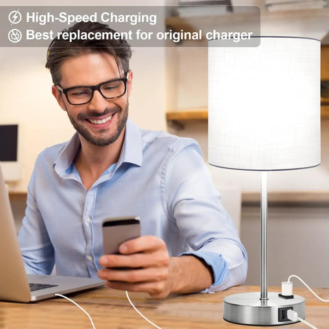 Man using Touch Table Lamp Set Of 2 with USB Ports and AC Outlet while charging phone, 3-way dimmable, white shade, modern design