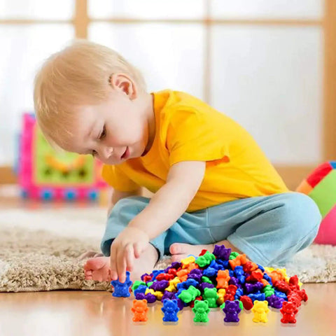 Child playing with Hella Cool Big Time 120 Piece Math Manipulatives Counting Bear Set With Vibrant Six Color Blocks.