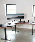VIVO Corner Standing Desk In Dark Walnut L Shaped Electric Height Adjustable Workstation With Monitor Mount Spacious 71 Inch Wide Surface For Home Office Ergonomic Computer Sit Stand Dual Screen Setup in modern office.