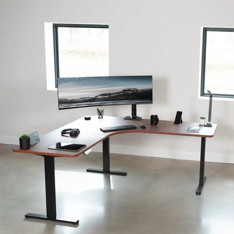VIVO Corner Standing Desk In Dark Walnut L Shaped Electric Height Adjustable Workstation With Monitor Mount Spacious 71 Inch Wide Surface For Home Office Ergonomic Computer Sit Stand Dual Screen Setup in modern office.