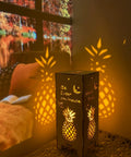 Cozy 13.5 Inch Pineapple Lantern Wooden Farmhouse Decor With Pineapple Motif Casting Warm Light Indoors.