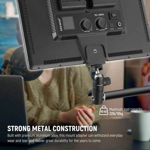 Light Stand Mount Adapter With Cold Shoe And Quarter Inch Screw Mini Ball Head supporting a screen, strong metal construction