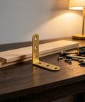 20 Piece L Bracket Set Stainless Steel Corner Braces 90 Degree Right Angles With 60 Screws on wooden table with tools