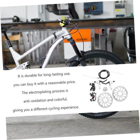 Rock Solid Mountain Bike Disc Brake Kit Featuring Hella Grippy Stopping Power and Lightweight Trail Upgrades Compatible with Most Fat Tire Cruisers and Dirt Bikes Premium Hydraulic Pads for Smooth Riding on a silver mountain bike.