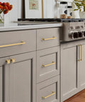 Champagne Bronze Cabinet Pulls Set installed on kitchen cabinets, 5 Inch Center To Center, Zinc Alloy, Rust Proof, 10 Pack