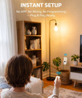 Person using Plug And Play Indoor Remote Control Outlet Kit With Expandable Wireless Light Switch On Off Power Switch 100 Ft RF Range in living room