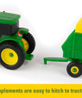 Close-up of John Deere Farm Toy Set 1 64 Scale Tractors And Trucks Playset with a tractor and hitchable trailer detail