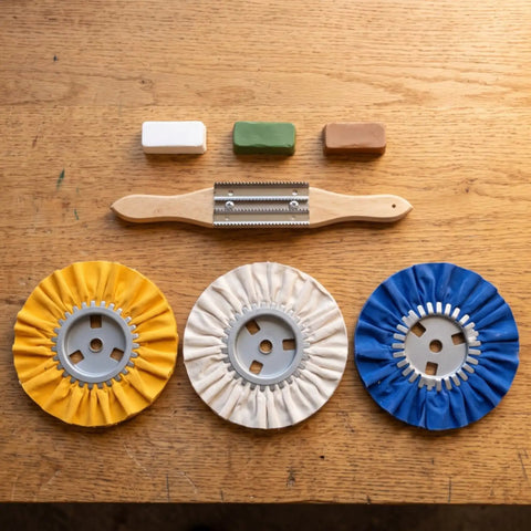 Get That Mirror Finish With These Rad Cloth Polishing Wheels! This 3 Piece Rotary Wheel Kit Includes Premium Buffing Agent For Woodworkers To Crush Impurities And Bring Woodwork Back To Life In The Workshop. Three fabric buffing wheels in yellow, white, and blue with a wooden tool and polishing compounds.
