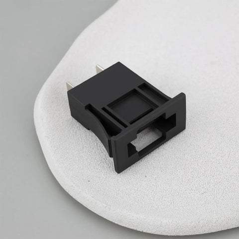 Close-up of Pair Of Rock Solid Automotive Blade Fuse Holders For Surface Mount PCB And Flush Panel Install, black plastic design.