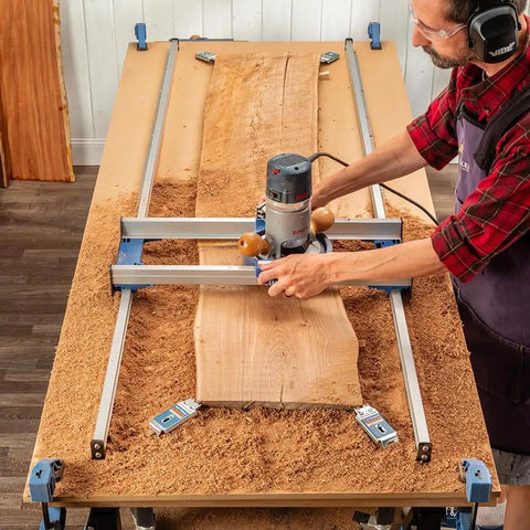 Woodworker using Benchtop Board Slab Flattening Jig For Your Router Sled System Precision Easy Flat Faces On Wood Slabs End Grain Boards And Resin Projects Durable Tabletop Jig That Fits Most Woodworking Routers on a wooden slab