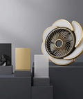 17-Inch Bladeless Ceiling Fan Light, Remote, 6-Speed, Low Profile, Gold displayed with decorative blocks.