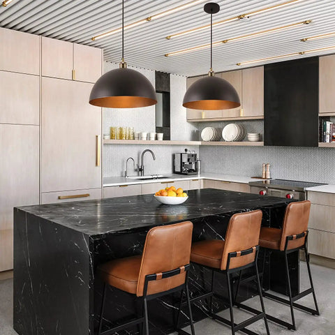 Vintage Black Pendant Light Dome Fixture With Retro Farmhouse Vibe in modern kitchen over black marble island and leather stools.