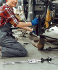 QWORK 3-jaw gear bearing slide hammer puller set, metallic silver automotive repair tool shown on shop floor.