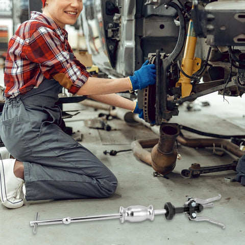 QWORK 3-jaw gear bearing slide hammer puller set, metallic silver automotive repair tool shown on shop floor.
