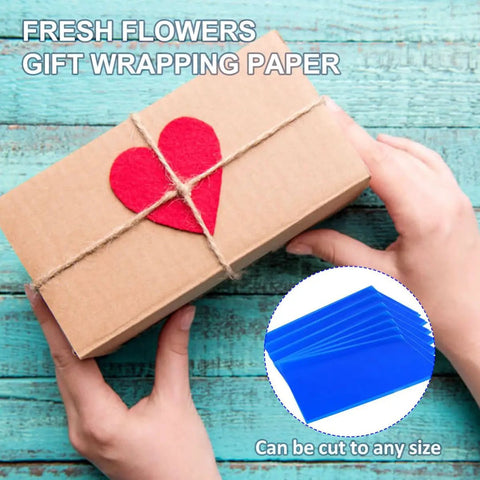 Hands holding a gift box with heart on twine, inset shows Blue Cellophane Flower Wrapping Paper Pack for Florists and DIY Peeps.