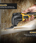 Side view of yellow and black cordless oscillating tool (20V) cutting wood; LED light visible.
