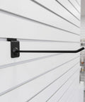 Heavy Duty Slat Wall Hooks Set For Slatwall And Garage Storage, 20-Piece Iron Slatboard Hooks displayed on white slatwall