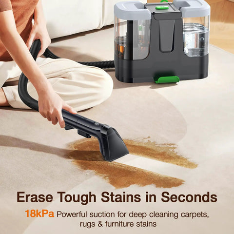 Person using portable vacuum with attachment to clean carpet, showcasing powerful suction for stain removal.