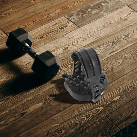 Replacement Bike Pedal Plates For Exercise Bike Beefy Heavy Duty Folding Pedals With Straps on wooden floor next to dumbbell