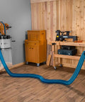 4 Inch Dust Collection Hose For Wood Shop And Shop Vac in use, connected to equipment, demonstrating reach and flexibility