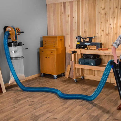 4 Inch Dust Collection Hose For Wood Shop And Shop Vac in use, connected to equipment, demonstrating reach and flexibility
