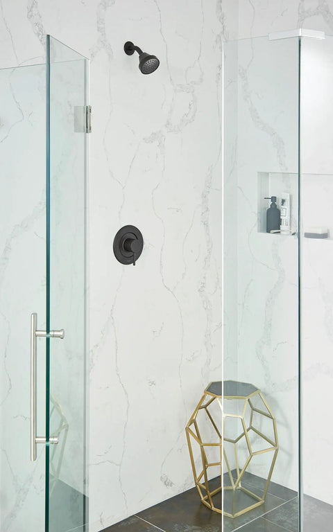 Align One-Function Eco-Performance Fixed Showerhead in matte black installed in modern bathroom with glass shower enclosure.