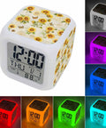 Compact Digital Alarm Clock With Cute Sunflower Butterfly Cube Shape Silent Sweep Motor And Soft Led Glow Includes Built In Snooze Button Shows Time Date And Room Temp, showing colorful LED glow options.