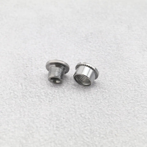 Close-up of 10 Piece Bicycle Chainring Screws And Crank Bolts Kit for mountain road and folding bikes on white background.
