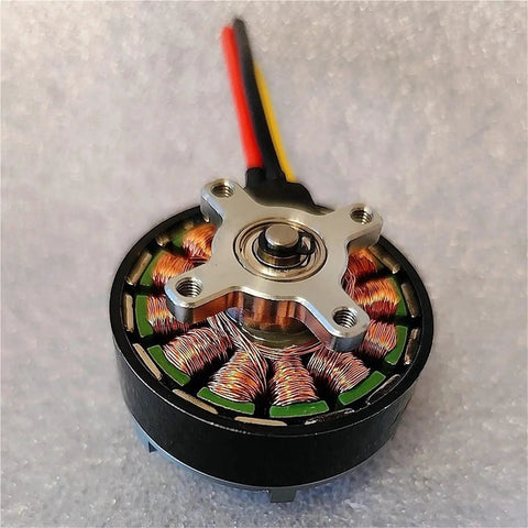 Outrunner Brushless Motor For RC Drones And Multirotors KV420 4230 size with aluminum housing and ball bearings on a textured surface