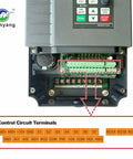 VFD drive with exposed green terminal blocks and Huanyang logo on gray metal enclosure.