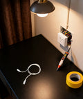 LED Tube Lamp Wire With 3 Pin Double End Connector Flexible Power Extension Cable on desk beside wall outlet