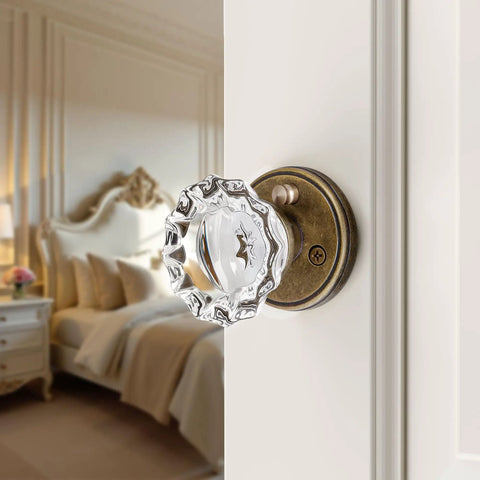 Antique Brass Crystal Door Knob Set For Interior Privacy Doors With Push Button Lock And Emergency Release shown on bedroom door