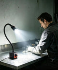 Heavy Duty Led Magnetic Work Light With Flexible Gooseneck Lamp providing 550 to 650 lumens illuminating a workshop workbench.
