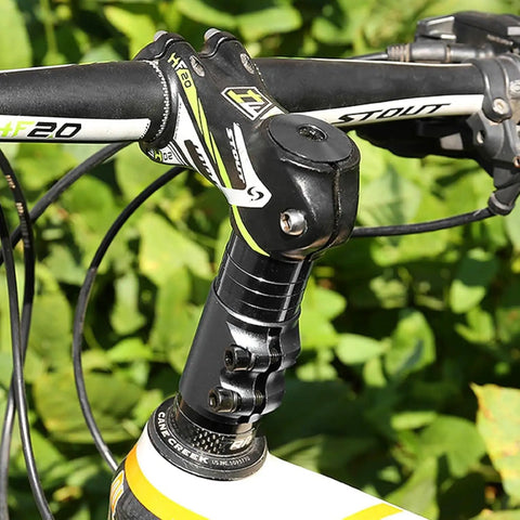 Adjustable 1-1/8 Inch Aluminum Bike Stem Riser Extender on mountain bike handlebar, boosting bar height with 28.6mm clamp.